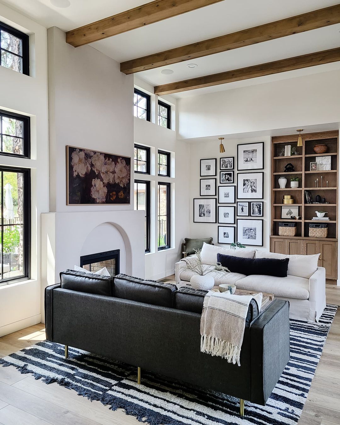 Modern Home with Black and White Couches and Gallery Wall. Photo by Instagram user @craven_haven