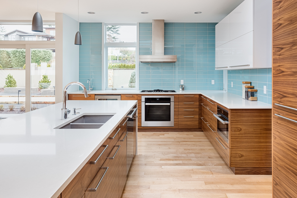 Beautiful blue kitchen with Modern designs and blue walls with an open floor plan.