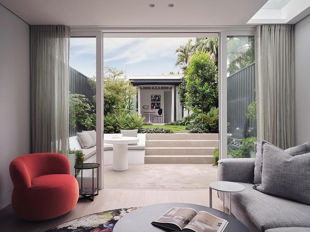 Home with Open Sliding Doors Leading to a Courtyard. Photo by Instagram user @hamptonarchitecture
