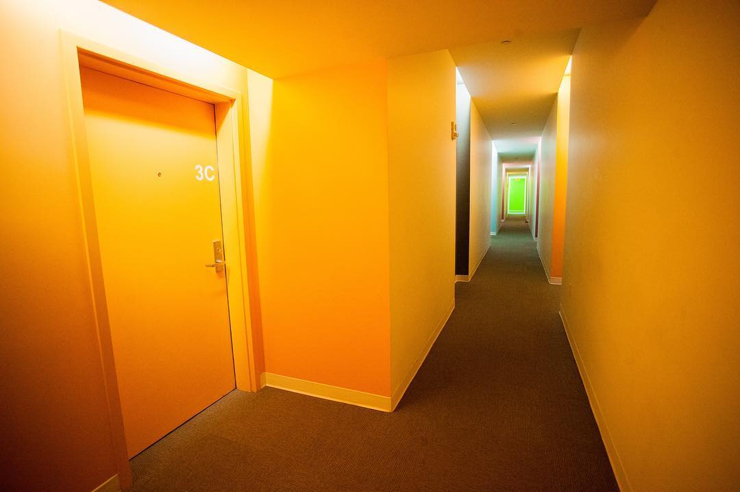 Apartment with an Orange Hallway. Photo by Instagram user @theluxliving_
