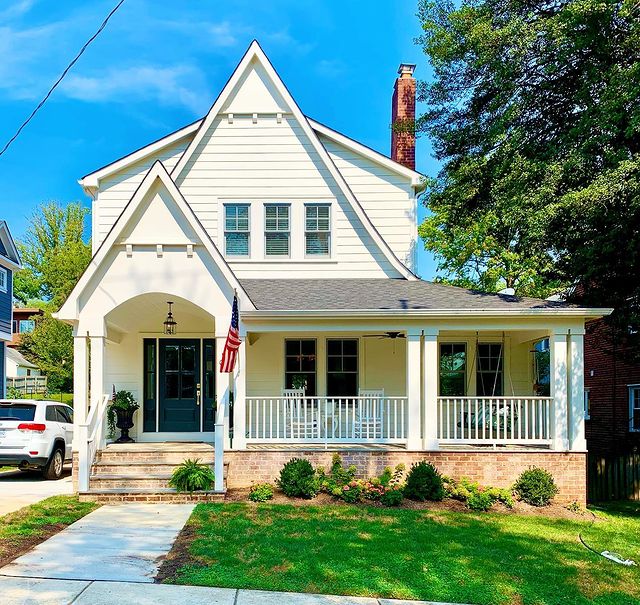 Historic house in Alexandria with unique architecture and a big front porch with a brick chimney and a landscaped path in front. Photo by instagram user @artyomshmatko