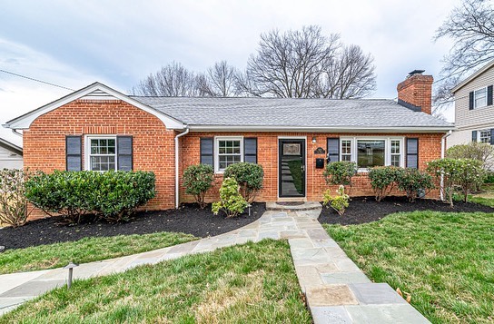 Brick ranch house with a large path in front and neat landscaping in Alexandria, Virginia. Photo by instagram user @trusst_residential