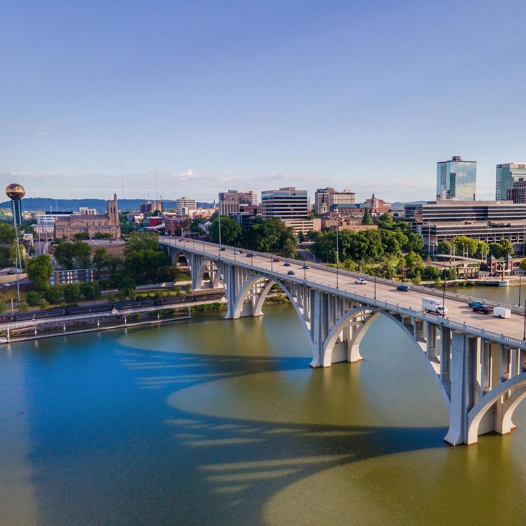 Aerial View of Cars Driving Into Knoxville over the River. Photo by Instagram user @stevenbeardenphoto