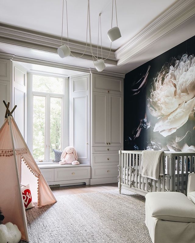 Baby's Nursery with Large Floral Mural on an Accent Wall. Photo by Instagram user @stofferphotographyinteriors