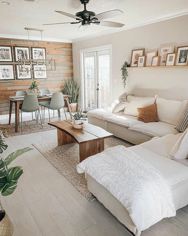 Bright Living Room with Wooden Plank Accent Wall. Photo by Instagram user @graceinteriorinspo