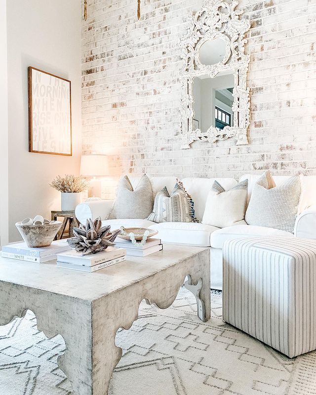 Living Room with Full Wall Brick Accent Wall. Photo by Instagram user @eachdayisacelebrationinc