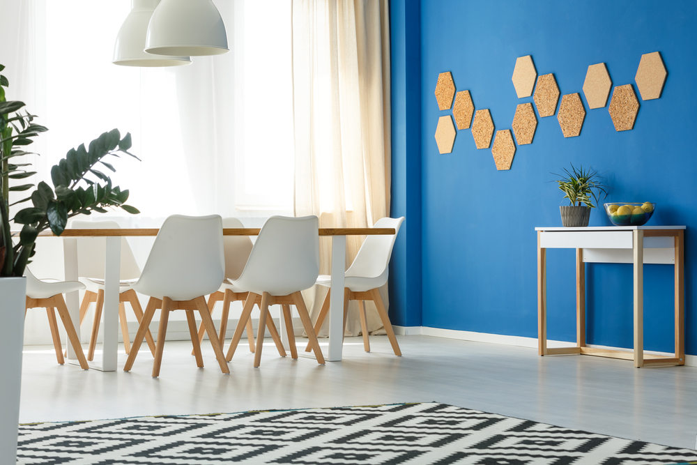 Blue Accent Wall with Geometric Shapes Added to It