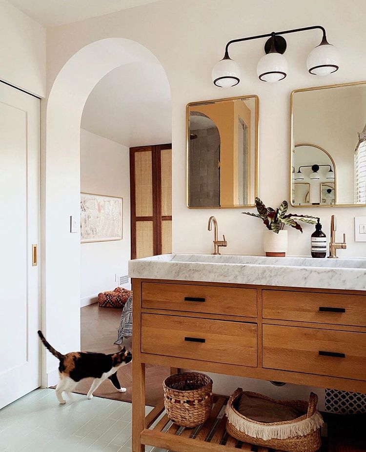 Interior view of bathroom with rustic and modern amenities.