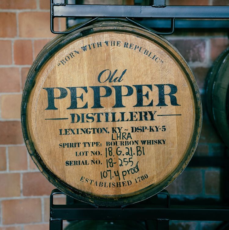 Bourbon barrel at a distillery with a signature stamp. Photo by instagram user @pepperdistillery