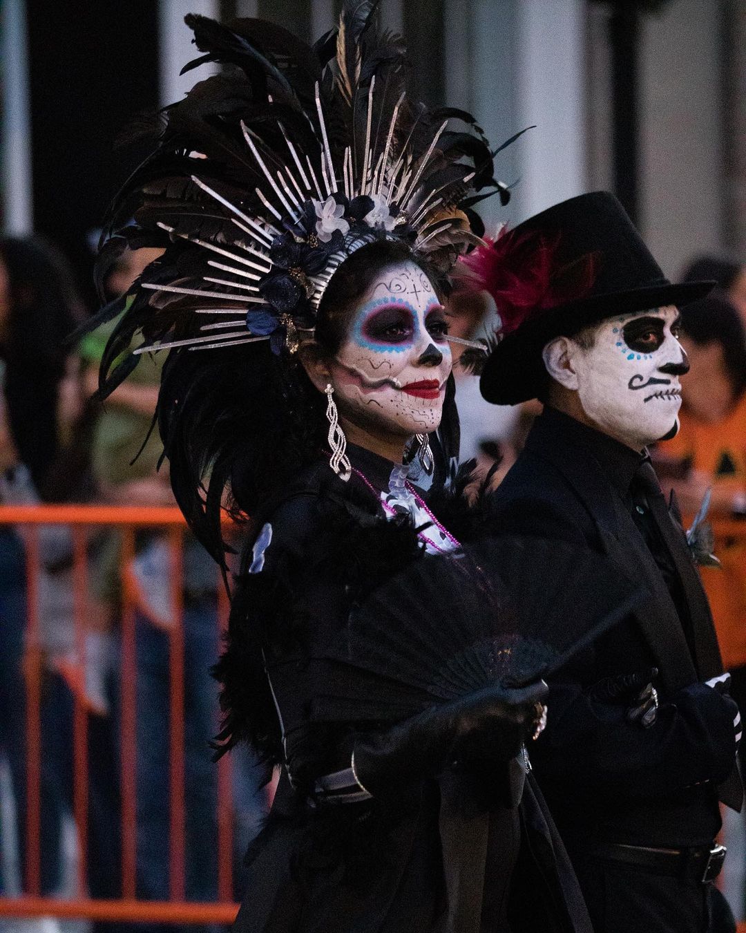 High-quality photo of participants marching in a parade for day of the dead in Lexington. Photo by instagram user @blueventuresphotography