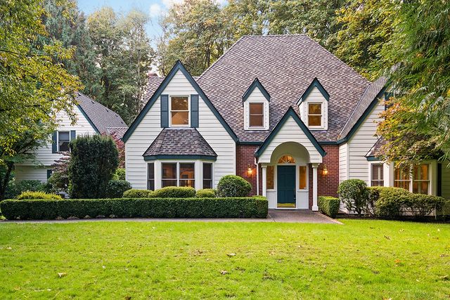 Exterior Photo of Traditional Styled Home with Evergreen Colored Trim on 2 Acres of Land.