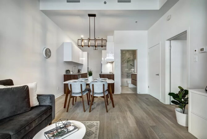 Interior view of modern dining area and living room.