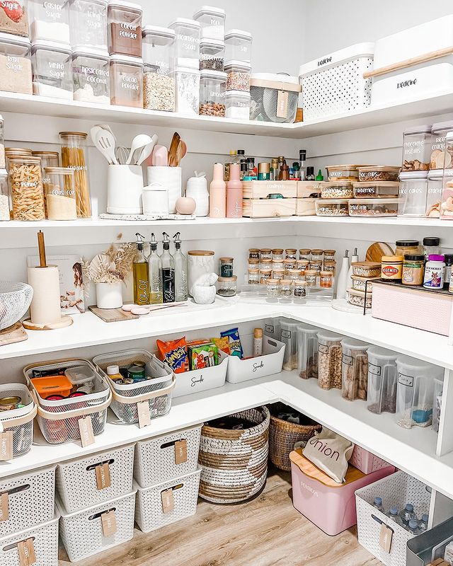 View of a walk-in pantry with optimized storage.
