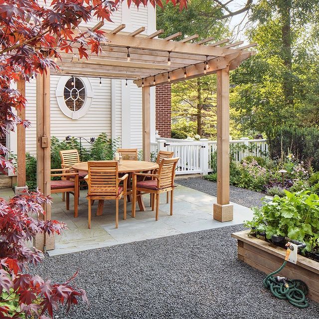 Exterior view of patio with wooden chairs and tables