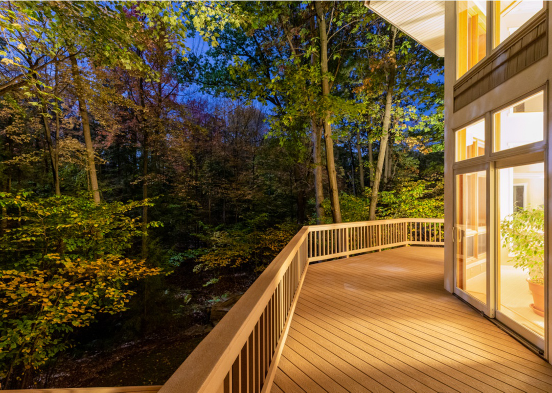 Exterior of home at night with composite deck