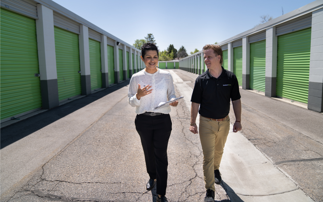 Extra Space Storage employees walking through self storage facility