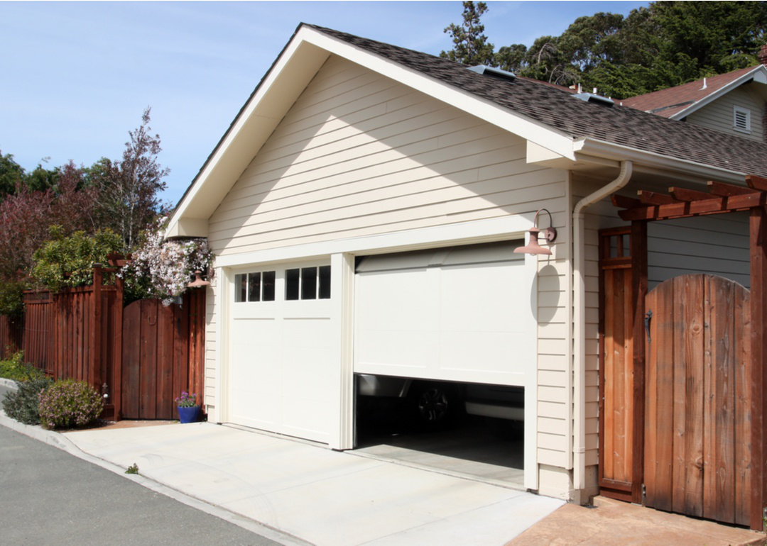 Exterior of home with garage door halfway open