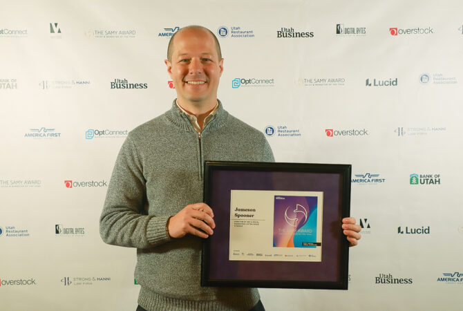 Jameson Spooner, Extra Space Storage Director of SEO & Social Media Marketing, with 2022 SAMY Award