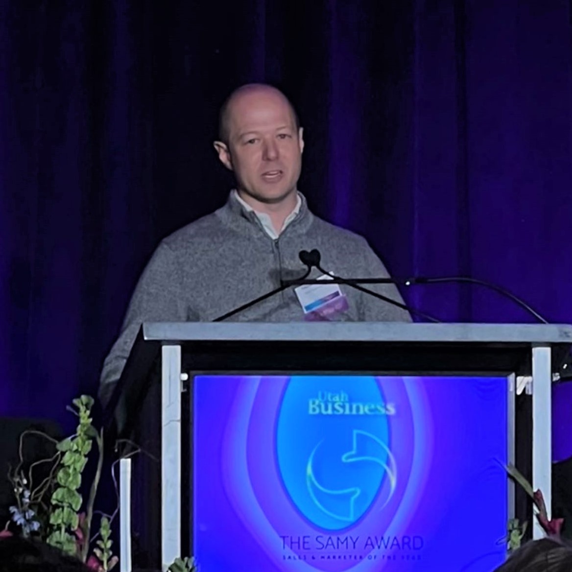 Jameson Spooner of Extra Space Storage accepting 2022 SAMY Award from Utah Business
