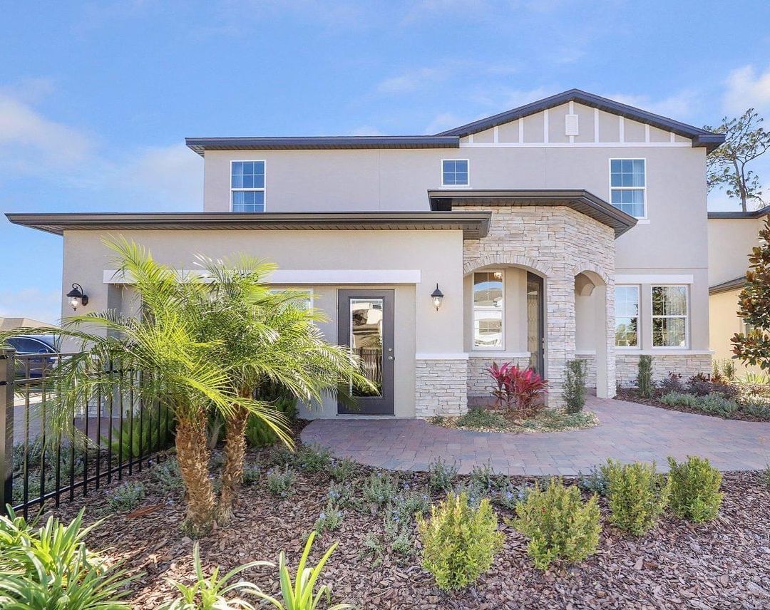 Exterior of a house in Orlando with brick accents and a brick pathway. Photo by Instagram user @realtorberni.