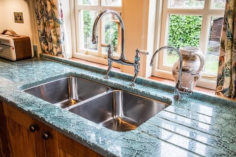 Kitchen countertop made out of recycled glass. Photo by Instagram user @sheffield_sustainable_kitchens.