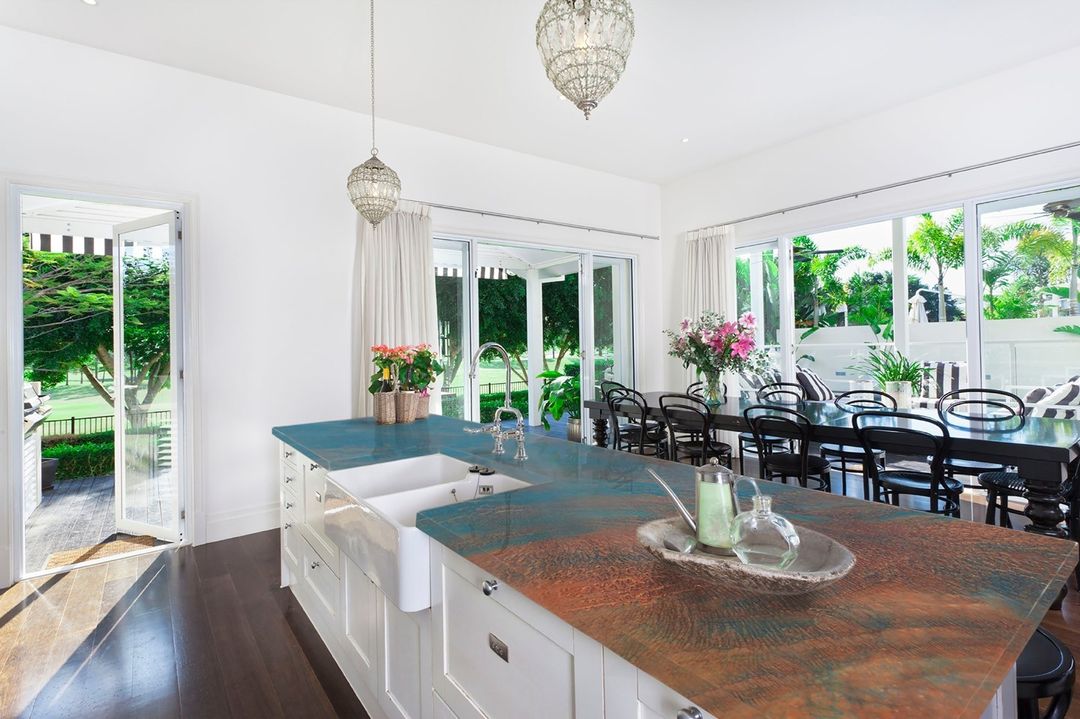 A kitchen with epoxy countertops with a copper patina. Photo by Instagram user @countertopepoxy.