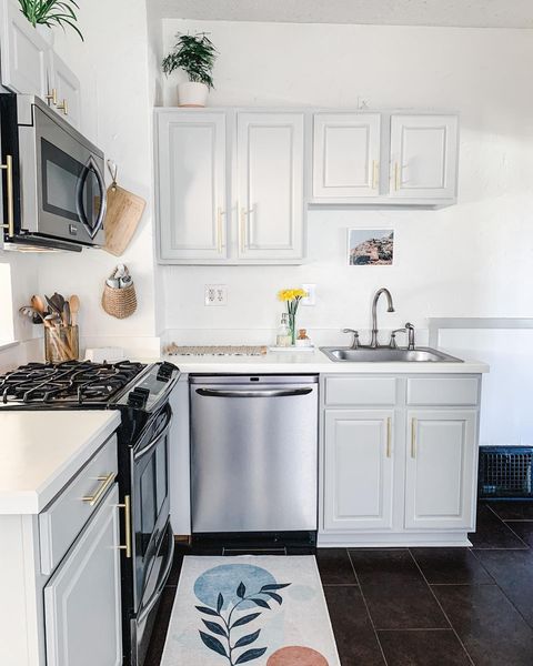 Kitchen with freshly painted cabinets and countertops. Photo by Instagram user @thematiffbungalow.