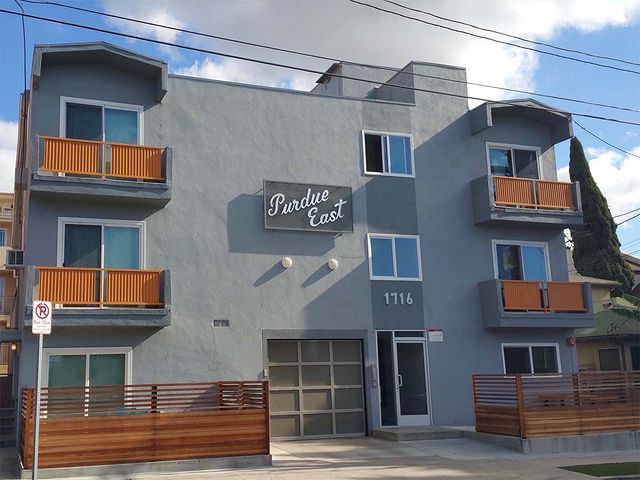 Outside view of modern apartments with patios and awnings