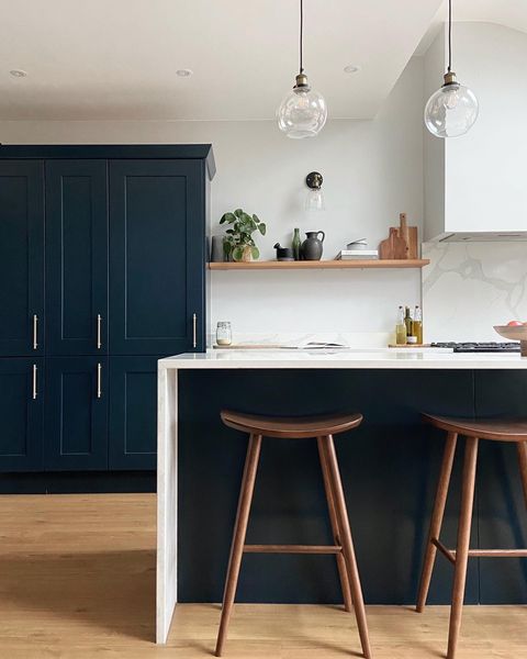 Kitchen interior with laminate wood-look flooring. Photo by Instagram user @alterior.living.
