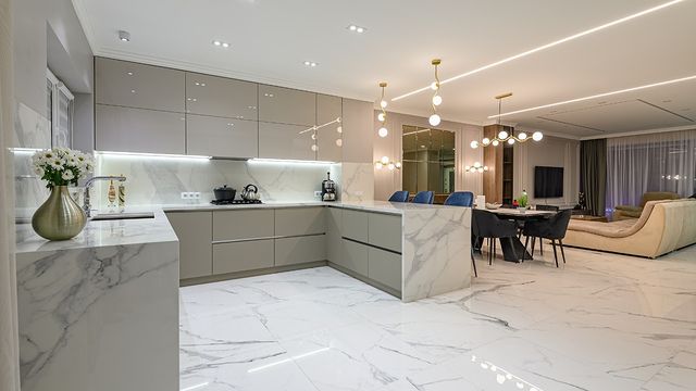 Large kitchen interior with marble flooring. Photo by Instagram user @therutlandcleaning.