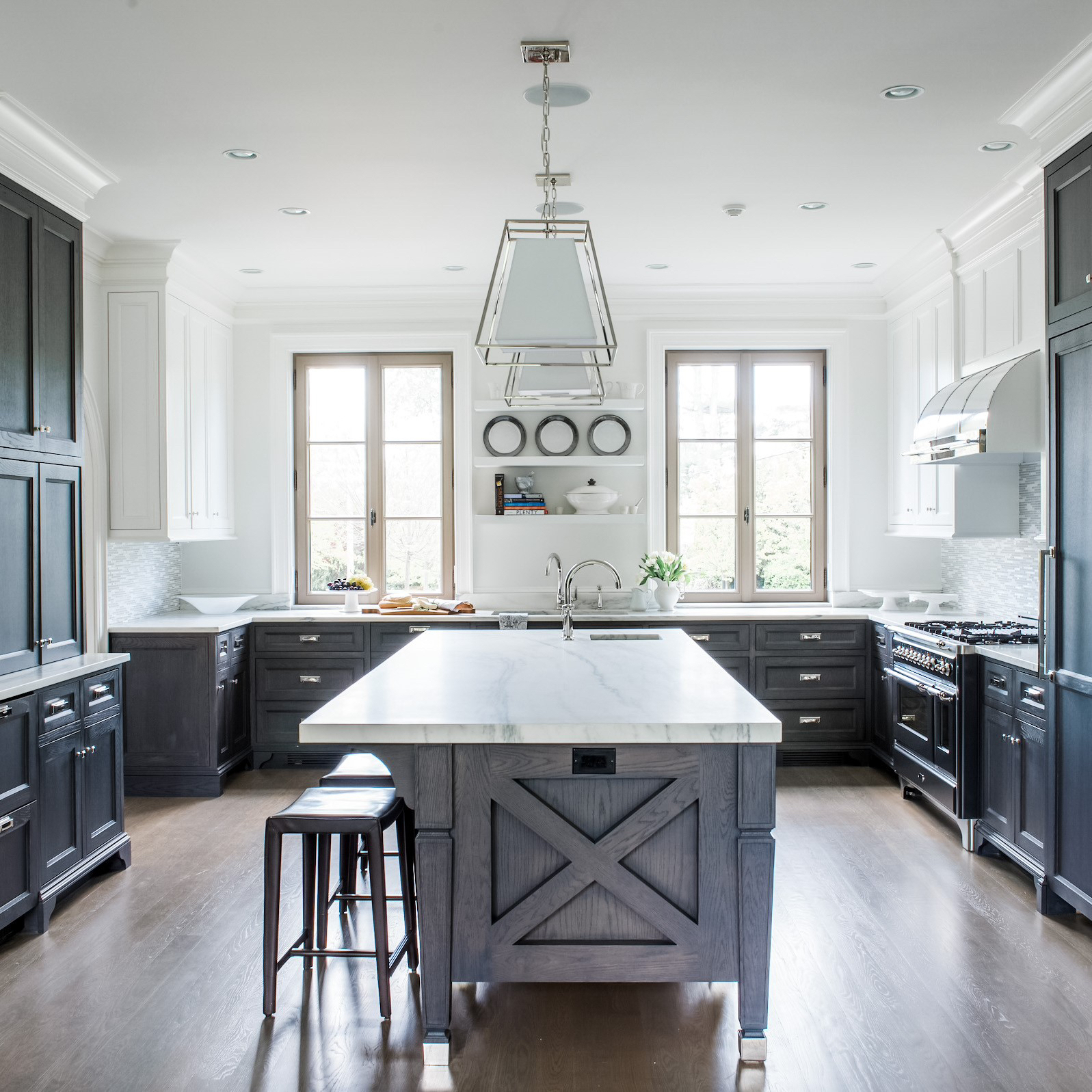 Blue-gray cabinetry in a bright kitchen. Photo by Instagram user @vanderhornarchitects