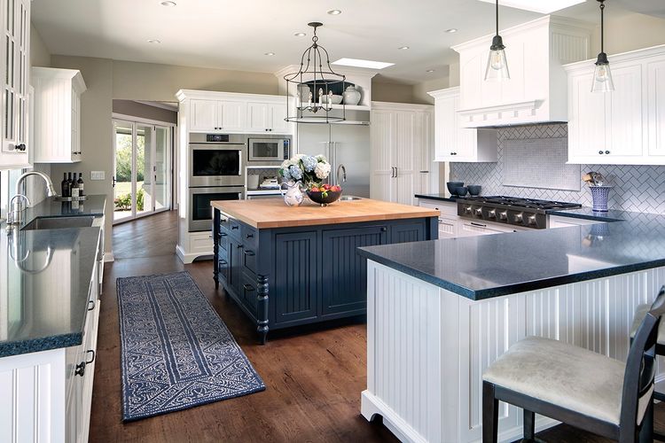 White and blue beadboard adorning cabinets. Photo by Instagram @keeping_interiors