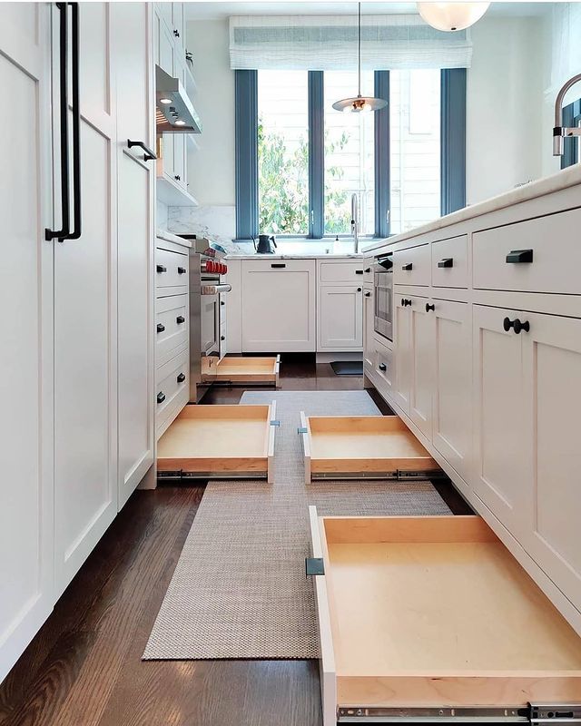Kitchen with toe-kick drawers out. Photo by Instagram user @nancyfromdc
