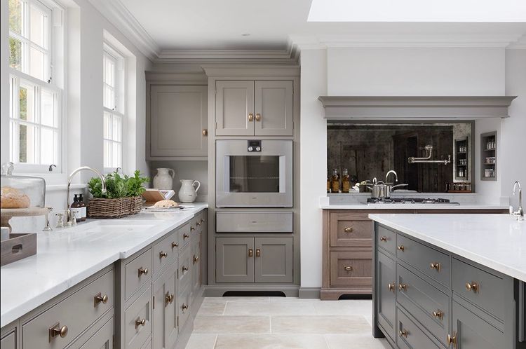 Gray cabinets in a dark, moody kitchen. Photo by Instagram user @paullmcraig