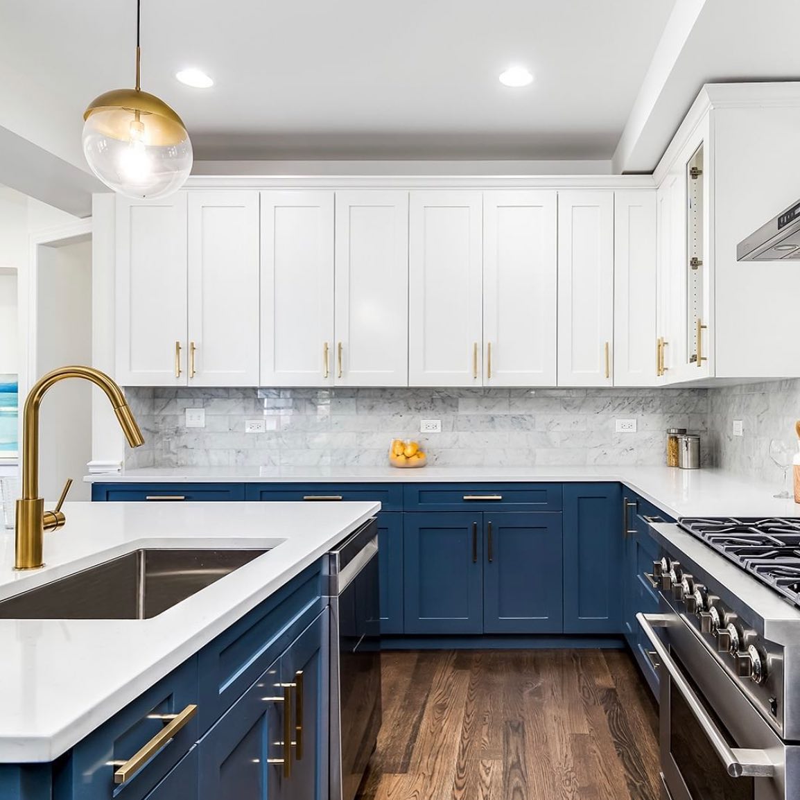 White upper cabinets and blue lower cabinets. Photo by Instagram user @512lifestyle