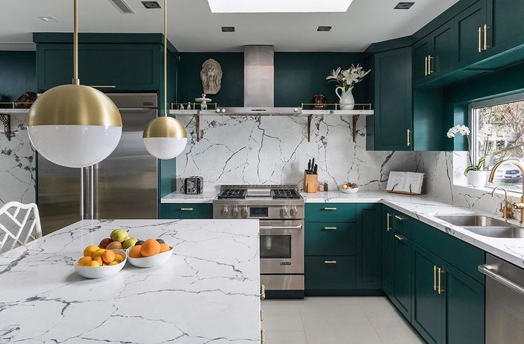 Turquoise cabinets with white marble cabinets. Photos by Instagram user @concept_renovations