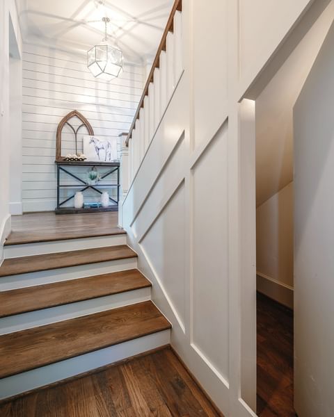 View of a stairway with an under the stairs hidden area