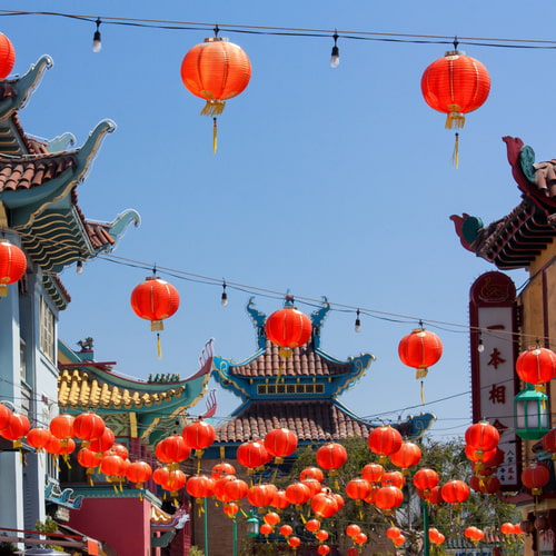 Red lanterns strung between traditional Chinese architecture in Los Angeles Chinatown