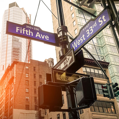 New York City street signs for Fifth Avenue and West 33rd St 