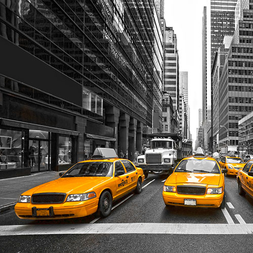 Bright yellow taxis on New York City street