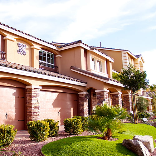 Side view of a tan Spanish Revival home in Las Vegas