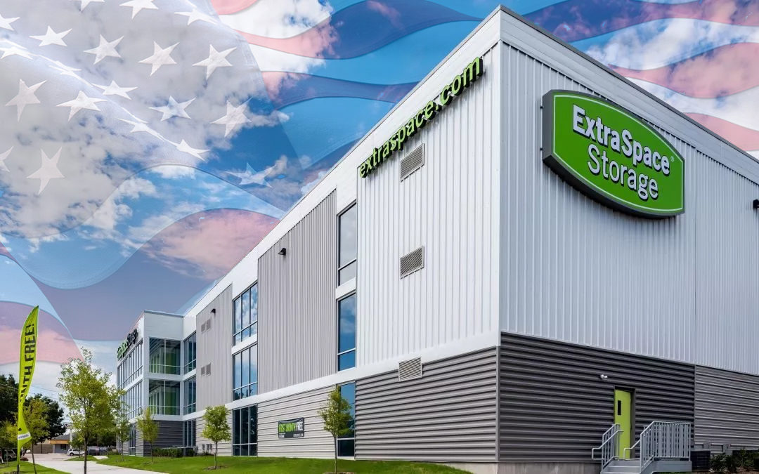 Extra Space Storage facility exterior with American flag background in sky