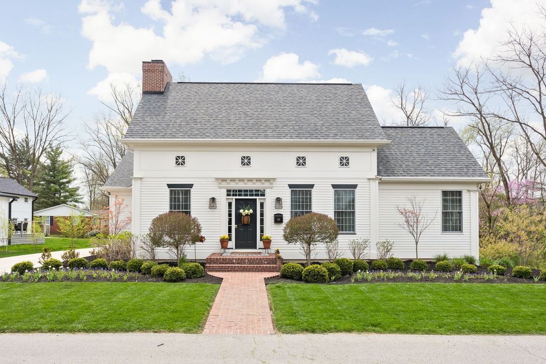 white Cape Cod style home. Photo via Instagram user @louwhitec21