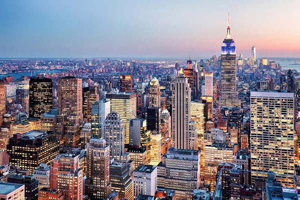 Aerial view of NYC skyscrapers and Empire State Building at dusk