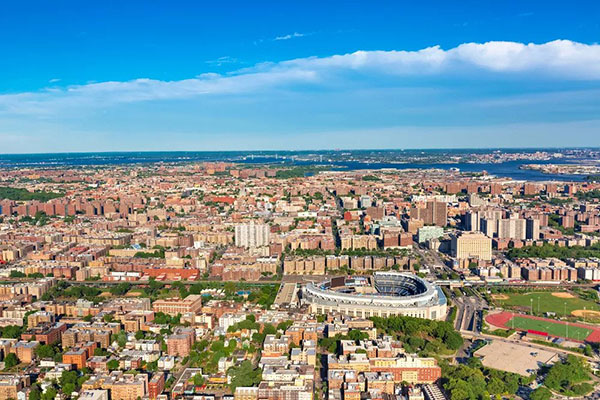 Aerial view of New York City buildings, stadium, and baseball field