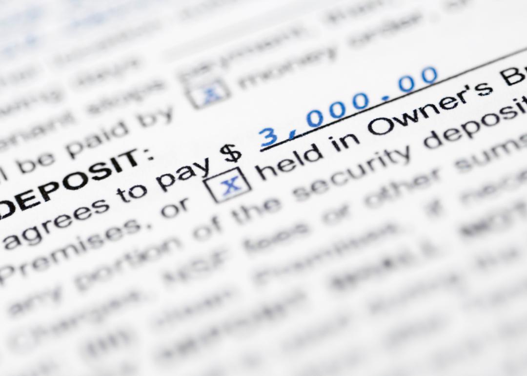 Close up of text in a rental agreement explaining security deposit rules