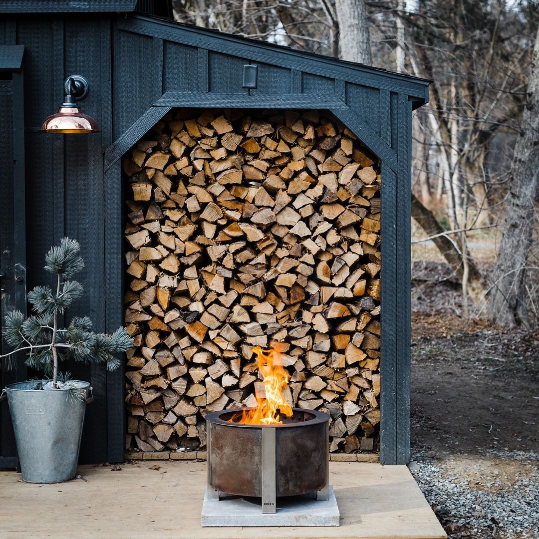 iron fire pit with wood logs