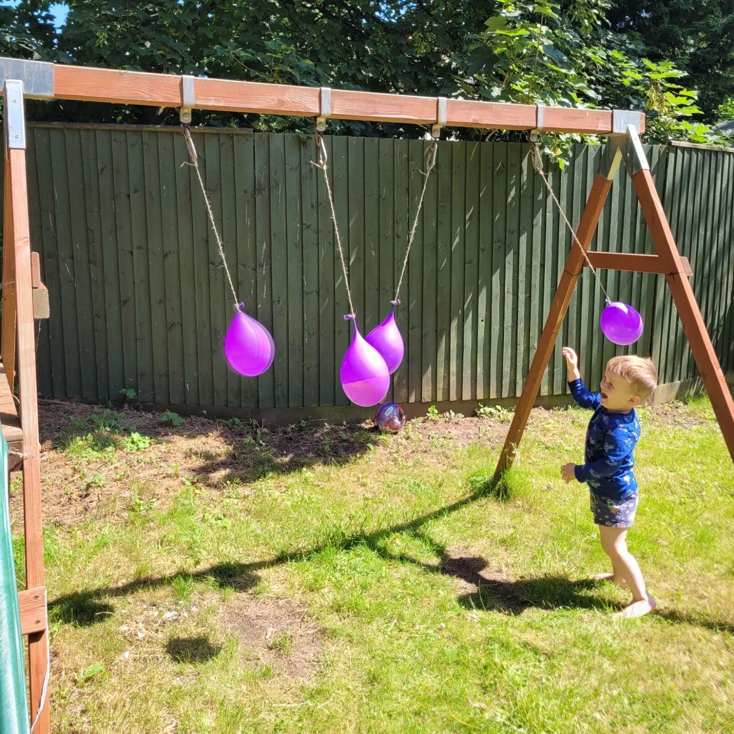 Hanging water balloons from backyard play structure. Photo by Instagram user @jam_potatoes