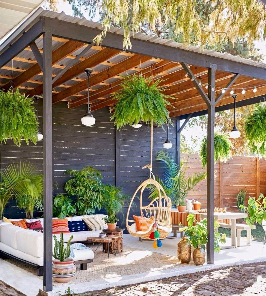 A backyard patio covered by a pergola. Photo by Instagram user @racheldianaestates