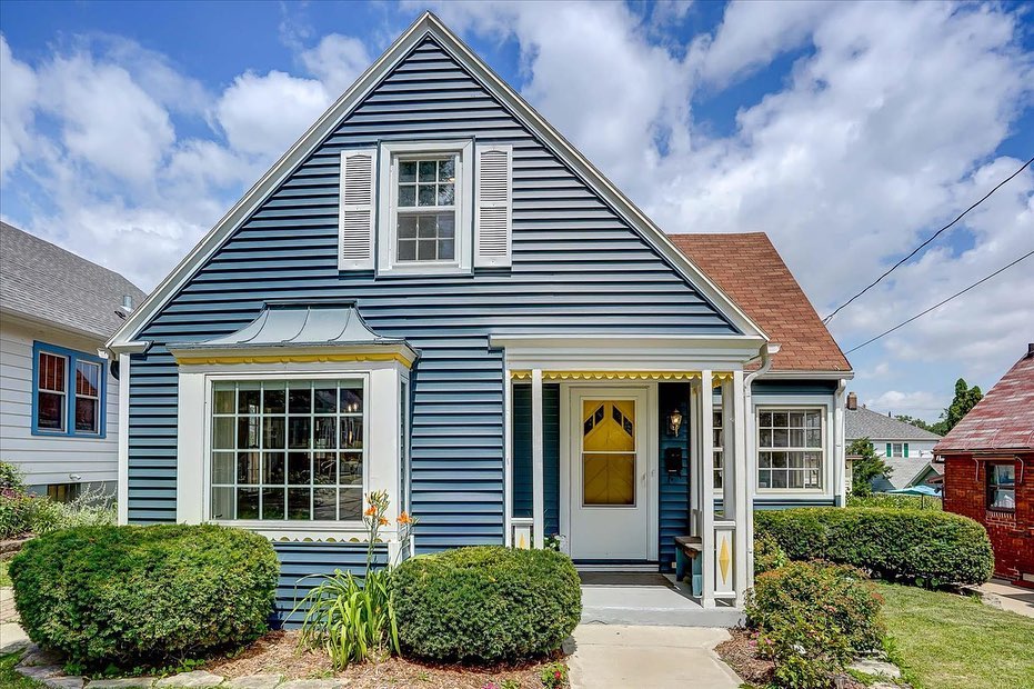 Light blue two-story Craftsman home in Atwood, Madison. Photo by Instagram username @matt.winz.real.estate.partners